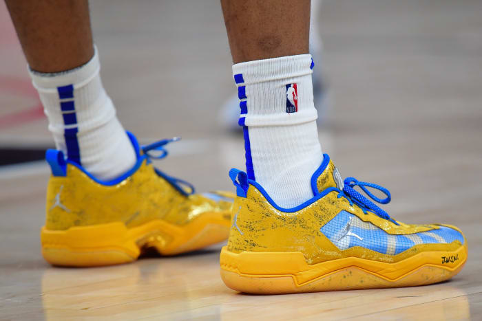 Los Angeles Clippers guard Russell Westbrook's blue and gold Jordan Brand shoes.